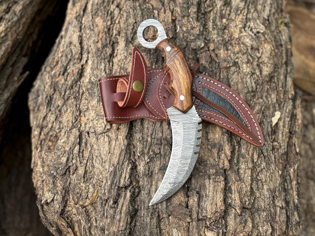 Handmade Damascus karambit knife with curved sawback blade and rosewood handle

